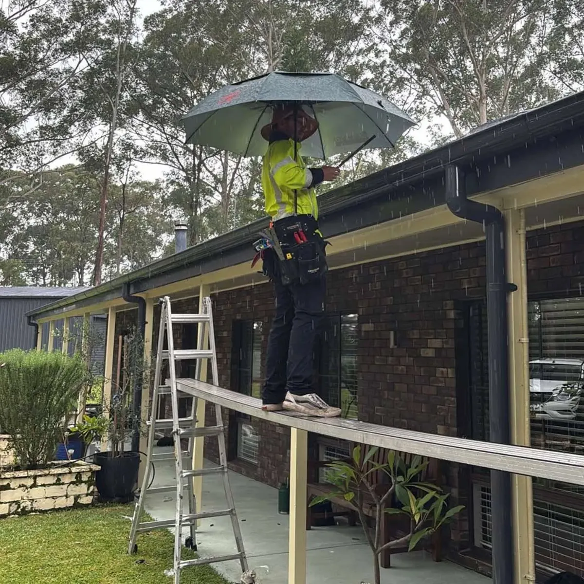 Working along the gutter line of a brick home