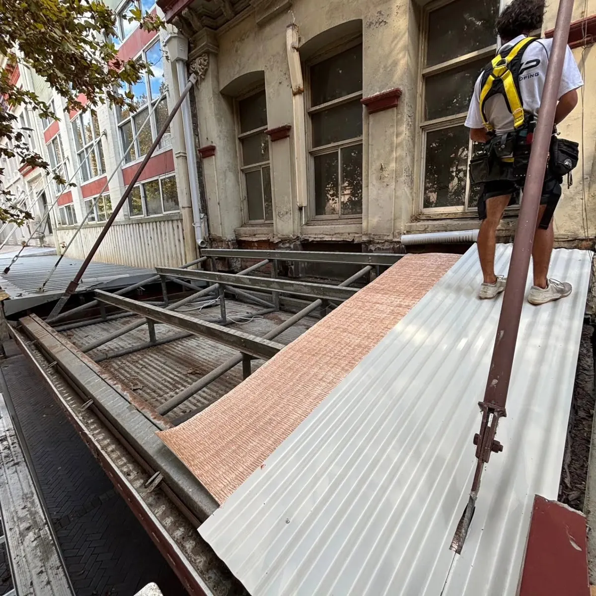 Re-sheeting the awning roof on a heritage building